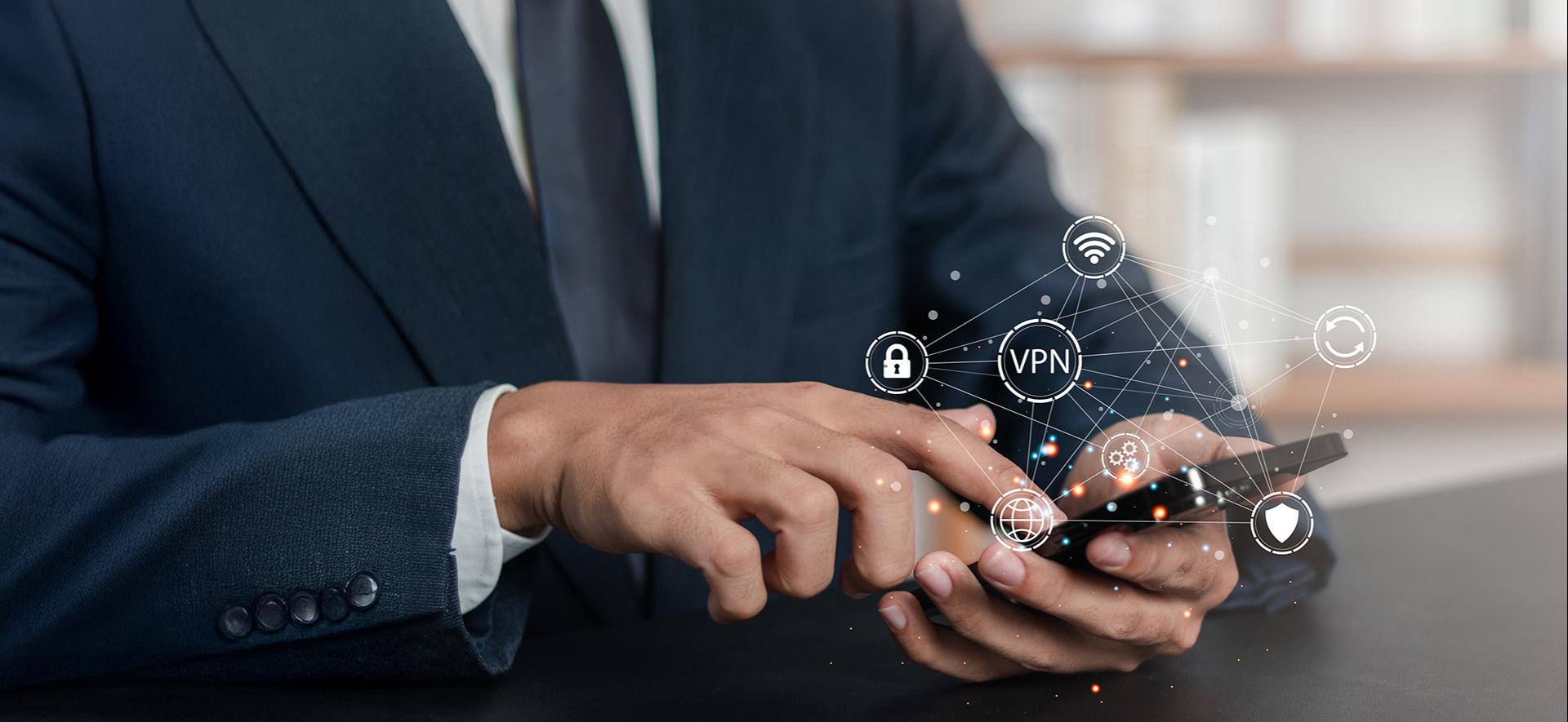 mężczyzna trzyma smartfna, z którego wyłaniają się ikony VPn i sieci