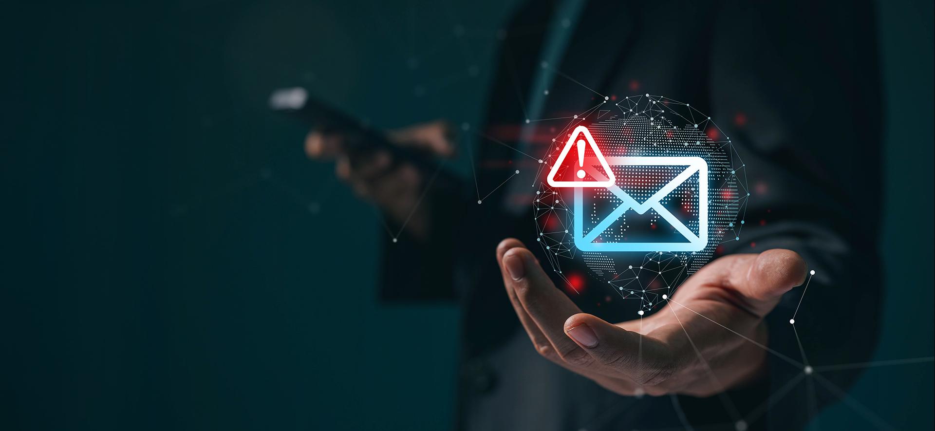 neonowa koperta z czerwonym wykrzyknikiem w rogu unosi się nad otwartą dłonią