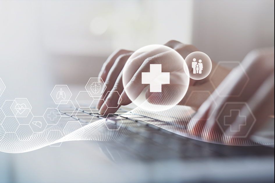 Ikonki związane ze zdrowiem, np. narządy. W tle rozmyte ręce uderzające w klawiaturę