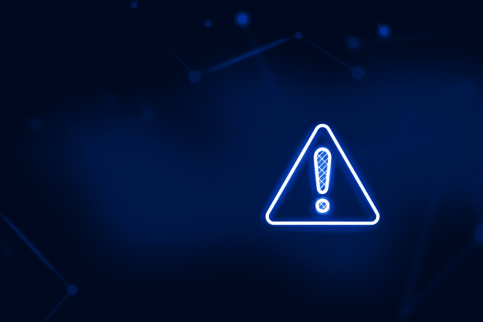 niebieski trójkąt z wykrzyknikiem na granatowym tle