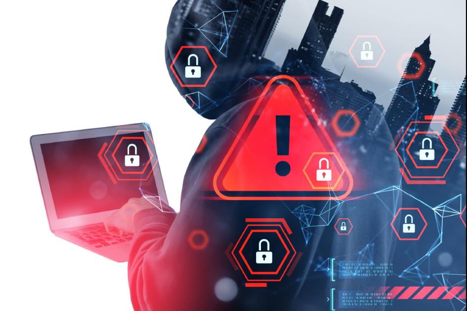 sylwetka człowieka trzymającego laptop przenikająca w panoramę miasta. Na przyszłym 